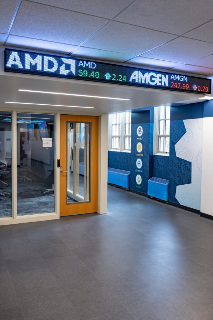 JCU Direct View LED Ticker inside Boler College at JCU Crescent Digital installed a digital stock ticker for John Carol University at the Boler College of Business