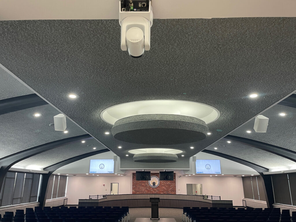 LG Video displays and PTZ Optics camera installed inside Flint City Council chambers.
