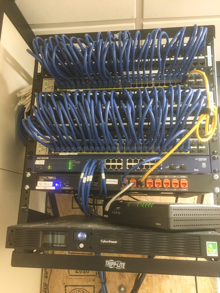 CVN IT Rack with Netgear and Arris hardware, installed by Crescent Digital.