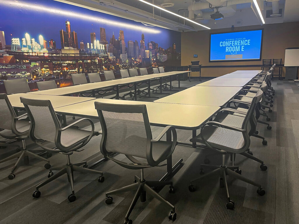 Conference room with Epson projector, Crestron control and Shure microphones, installed and integrated by Crescent Digital